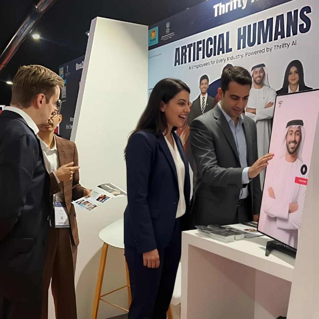 Visitors meeting an AI employee at the Thrifty AI booth